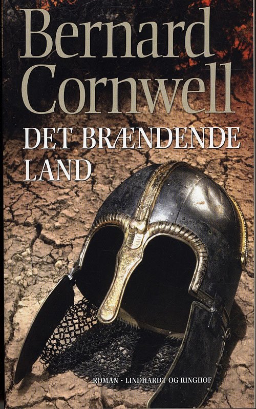 Cover for Bernard Cornwell · Det brændende land, pb. (SAKS 5) (Paperback Bog) [3. udgave] (2011)