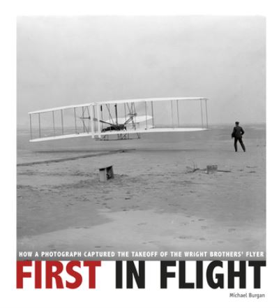 Cover for Michael Burgan · First in Flight How a Photograph Captured the Takeoff of the Wright Brothers' Flyer (Hardcover Book) (2020)