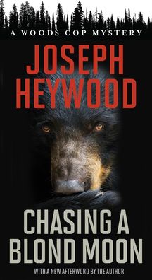 Cover for Joseph Heywood · Chasing a Blond Moon: A Woods Cop Mystery (Paperback Book) (2022)