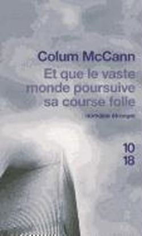 Cover for Colum Mccann · Et Que Le Vaste Monde Poursuive Sa Course Folle (Paperback Bog) [French edition] (2010)