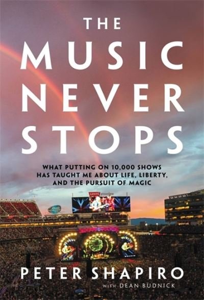 Peter Shapiro · The Music Never Stops. What Putting On 10.000 Shows Has Taught Me About Life. Liberty And The Pursuit Of Magic Hardback Book (Book) (2022)