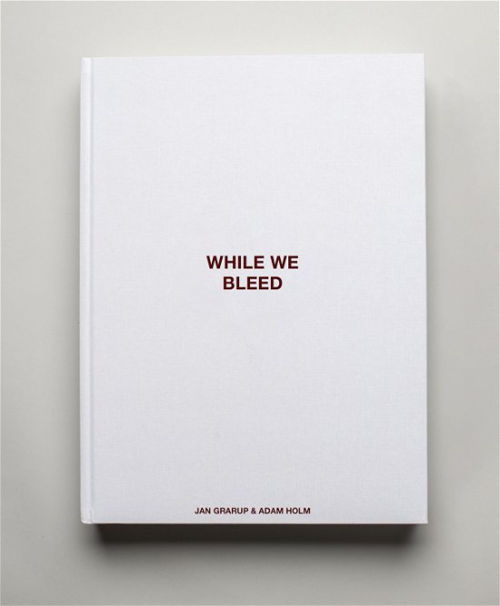 Cover for Jan Grarup and Adam Holm · WHILE WE BLEED - The limited edition (Gebundenes Buch) (2023)