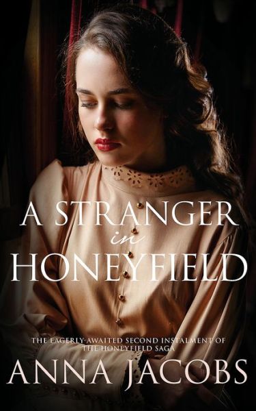 Cover for Anna Jacobs · A Stranger in Honeyfield: From the multi-million copy bestselling author - The Honeyfield Series (Taschenbuch) (2017)