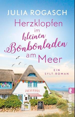 Cover for Julia Rogasch · Herzklopfen im kleinen Bonbonladen am Meer (Book) (2024)