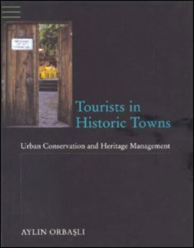 Cover for Aylin Orbasli · Tourists in Historic Towns: Urban Conservation and Heritage Management (Taschenbuch) (2000)