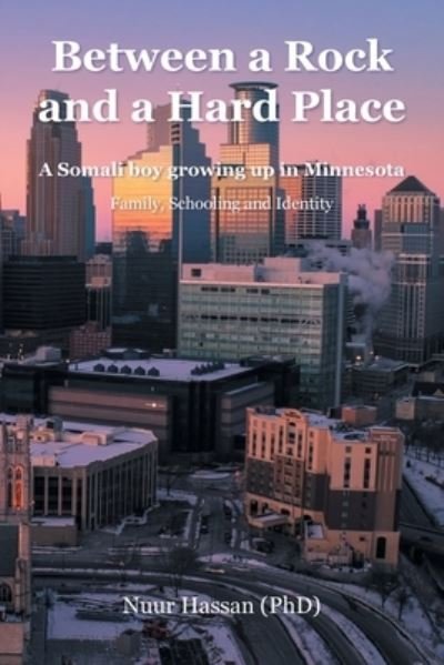 Cover for Nuur Hassan (PhD) · Between a Rock and a Hard Place: A Somali boy growing up in Minnesota:  Family, Schooling and Identity (Paperback Bog) (2022)