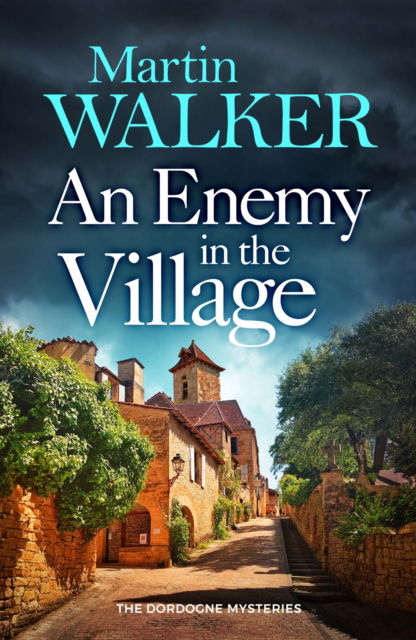 Cover for Martin Walker · An Enemy in the Village (Paperback Book) (2025)