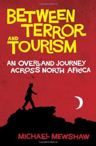 Cover for Michael Mewshaw · Between Terror and Tourism: An Overland Journey Across North Africa (Taschenbuch) (2010)