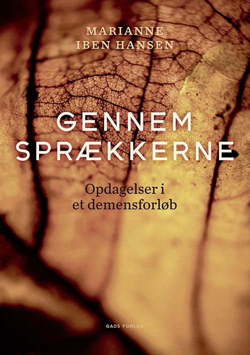 Cover for Marianne Iben Hansen · Gennem sprækkerne (Sewn Spine Book) [1. Painos] (2021)