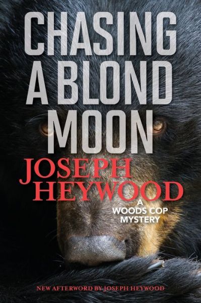 Cover for Joseph Heywood · Chasing a Blond Moon: A Woods Cop Mystery (Paperback Book) (2019)