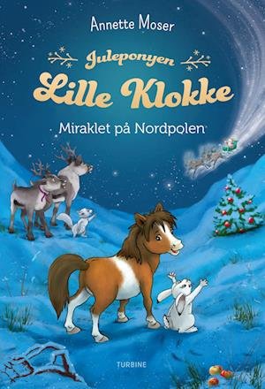 Cover for Annette Moser · Juleponyen Lille Klokke – Miraklet på Nordpolen (Hardcover bog) [1. udgave] (2023)