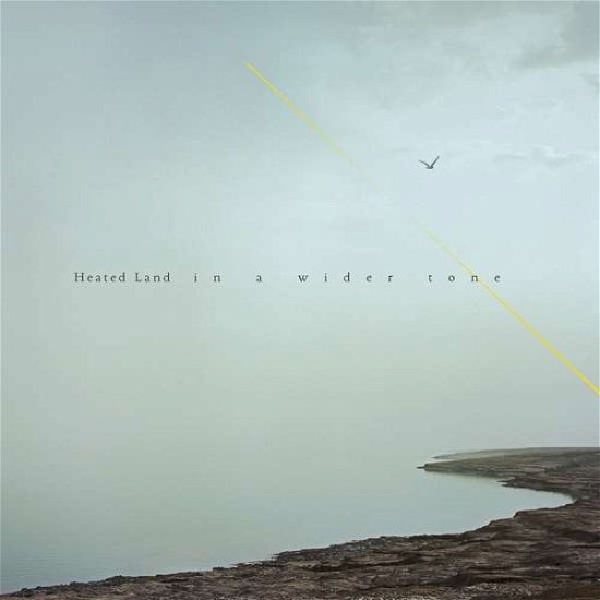 Cover for Heated Land · In A Wider Tone (CD) (2019)