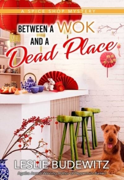 Cover for Leslie Budewitz · Between A Wok And A Dead Place (Paperback Book) (2023)