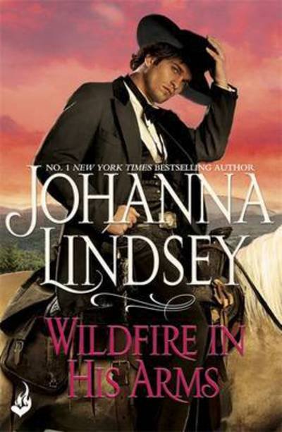 Wildfire In His Arms: A dangerous gunfighter falls for a beautiful outlaw in this compelling historical romance from the legendary bestseller - Johanna Lindsey - Books - Headline Publishing Group - 9781472233790 - February 23, 2016