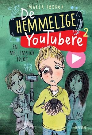 Cover for Maria Rørbæk · De Hemmelige Youtubere: De Hemmelige Youtubere 2 - En mellemstor idiot (Hardcover bog) [1. udgave] (2020)