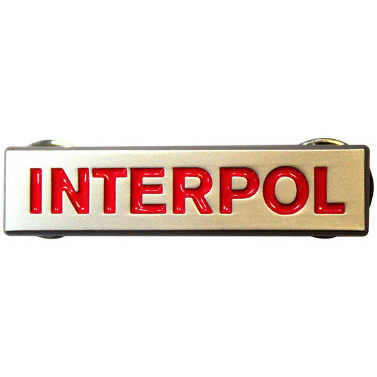 Interpol Pin Badge: Text Logo - Interpol - Gadżety -  - 5056737266900 - 22 lipca 2024